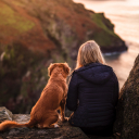 Debbie Anderson with her dog overlooking the Oregon coast.